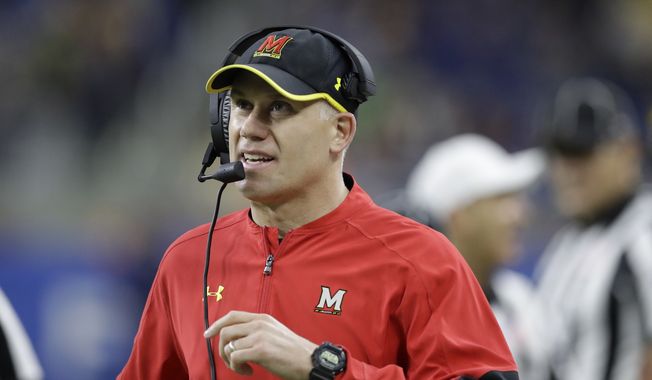 FILE - In this Dec. 26, 2016, file photo, Maryland head coach DJ Durkin walks the sideline during the first half of the Quick Lane Bowl NCAA college football game against Boston College in Detroit. Maryland placed the head of the football team's strength and conditioning staff on paid leave while it investigates claims he verbally abused and humiliated players, a person briefed on the situation said. The person spoke to The Associated Press on Saturday, Aug. 11, 2018, on condition of anonymity because Maryland had not announced the decision regarding Rick Court. The person says athletic director Damon Evans spoke with the football team Saturday morning and Durkin was still leading the program.  (AP Photo/Carlos Osorio, File)