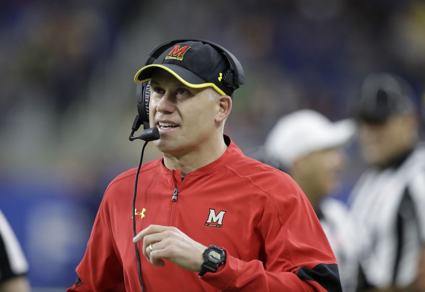 FILE - In this Dec. 26, 2016, file photo, Maryland head coach DJ Durkin walks the sideline during the first half of the Quick Lane Bowl NCAA college football game against Boston College in Detroit. Maryland placed the head of the football team's strength and conditioning staff on paid leave while it investigates claims he verbally abused and humiliated players, a person briefed on the situation said. The person spoke to The Associated Press on Saturday, Aug. 11, 2018, on condition of anonymity because Maryland had not announced the decision regarding Rick Court. The person says athletic director Damon Evans spoke with the football team Saturday morning and Durkin was still leading the program. (AP Photo/Carlos Osorio, File)