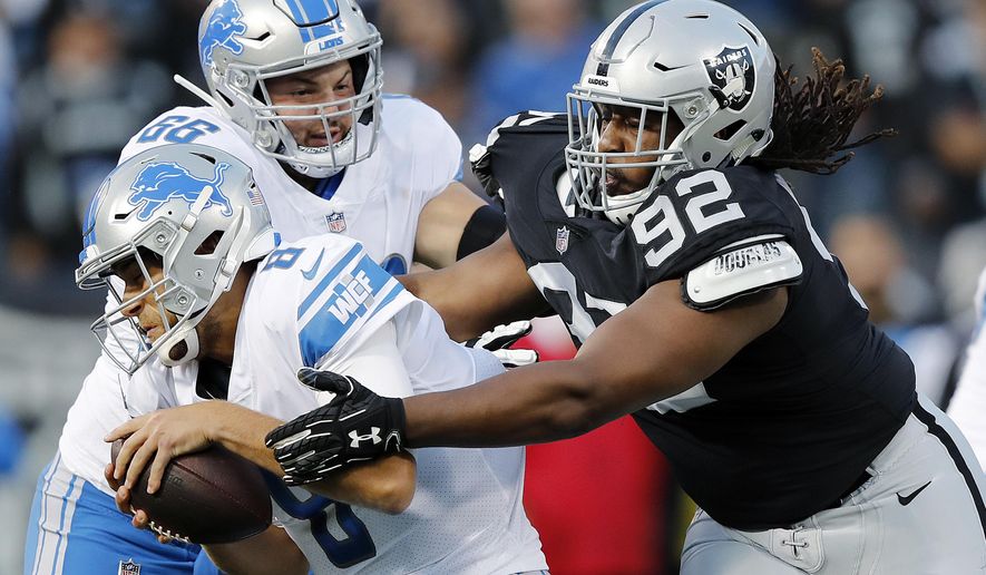 Detroit Lions quarterback Matt Cassel, left, is sacked by Oakland Raiders nose tackle P.J. Hall (92) during the first half of an NFL preseason football game in Oakland, Calif., Friday, Aug. 10, 2018. (AP Photo/John Hefti)