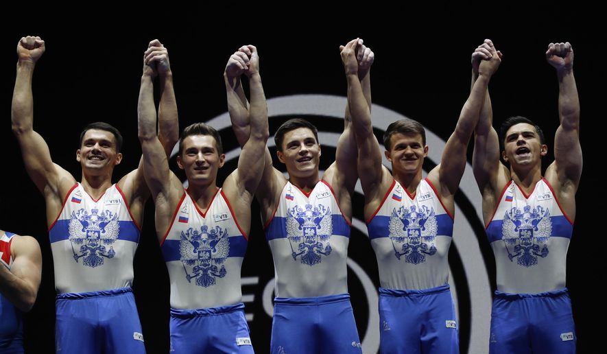 Members of the Russian team hold up their gold medals after placing first in the men&#39;s artistic gymnastics team finals at the European Championships in Glasgow, Scotland, Saturday, Aug. 11, 2018. From left, Nikita Nagornyy, David Belyavskiy, Nikolai Kuksenkov, Dmitrii Lankin and Artur Dalaloyan. (AP Photo/Darko Bandic)