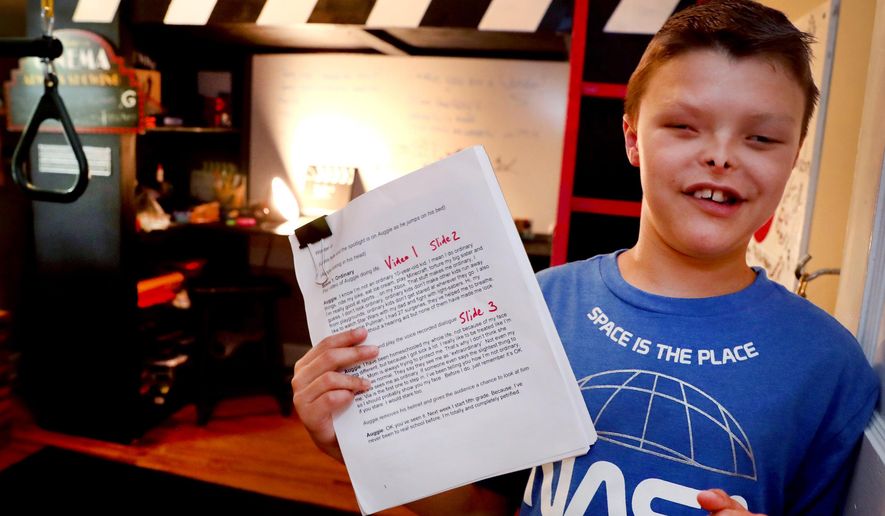 Zaden Dill, 11, has undergone 60 plus surgeries and has differences, but like the lead character in the movie "Wonder" Dill has embraced his differences show off his play that he has written, while standing in his bedroom on Thursday, May, 31 2018 in Murfreesboro, Tenn. (Helen Comer/The Daily News Journal via AP)
