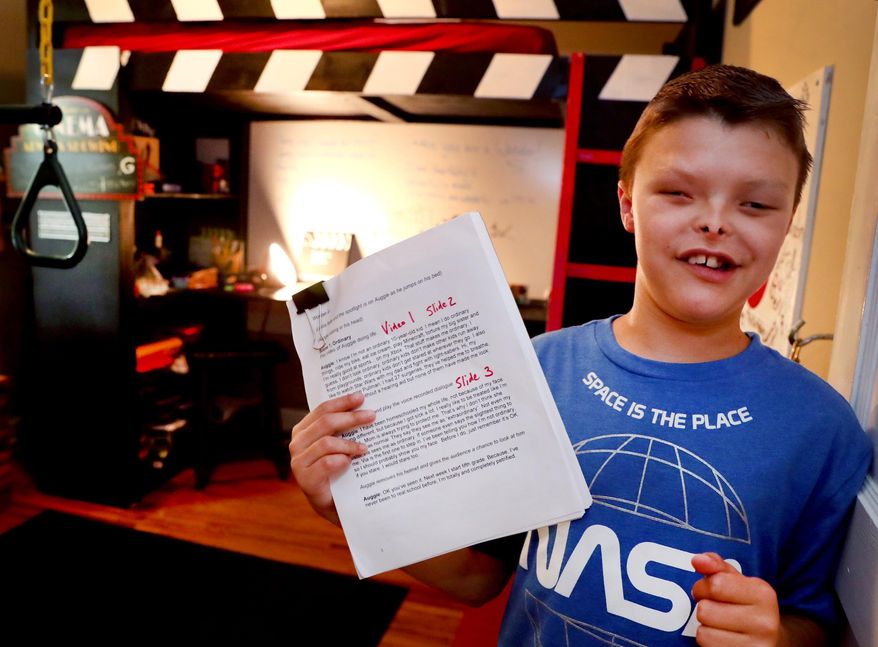 Zaden Dill, 11, has undergone 60 plus surgeries and has differences, but like the lead character in the movie "Wonder" Dill has embraced his differences show off his play that he has written, while standing in his bedroom on Thursday, May, 31 2018 in Murfreesboro, Tenn. (Helen Comer/The Daily News Journal via AP)