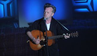 FILE - In this Thursday, June 14, 2018, file photo, John Mellencamp performs on stage during the 49th annual Songwriters Hall of Fame Induction and Awards gala at the New York Marriott Marquis Hotel in New York. The Butler Institute of American Art in Youngstown, Ohio, has announced a new exhibition of paintings by rocker John Mellencamp, known for his expressionistic oil portraits and other works. “John Mellencamp: Expressionist” opens Sept. 20 and runs through Nov. 18. It will include portraits and mixed-media pieces. (Photo by Brad Barket/Invision/AP, File)