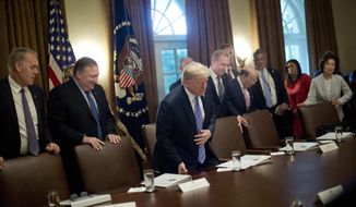 In this July 18, 2018, file photo, President Donald Trump, center, takes his seat before the start of his meeting with members of his Cabinet in the Cabinet Room of the White House in Washington. Also taking their seats are from left, Interior Secretary Ryan Zinke, Secretary of State Mike Pompeo, Deputy Secretary of Defense Patrick Shanahan, Commerce Secretary Wilbur Ross, White House deputy chief of staff for communications Bill Shine, White House press secretary Sarah Huckabee Sanders and Transportation Secretary Elaine Chao. For years Shine carried out Roger Ailes’ orders, earning himself the nicknamed “the Butler” at Fox. Now, Shine is serving the same role under Trump. Shine has yet to select a permanent office or unpack his stuff. But he has been putting his mark on the West Wing. (AP Photo/Pablo Martinez Monsivais, File)
