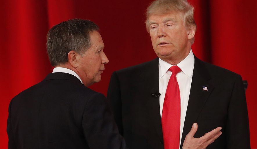 Republican presidential candidate, Ohio Gov. John Kasich, left, speaks to Republican presidential candidate, businessman Donald Trump  during a commercial break during the CBS News Republican presidential debate at the Peace Center, Saturday, Feb. 13, 2016, in Greenville, S.C. (AP Photo/John Bazemore)