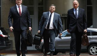 Members of the defense team for Paul Manafort, including Kevin Downing, left, Richard Westling, and Thomas Zehnle, walk to federal court as the trial of the former Trump campaign chairman continues, in Alexandria, Va., Monday, Aug. 13, 2018.  (AP Photo/Jacquelyn Martin)
