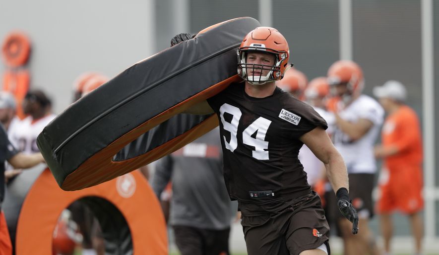 In this Thursday, July 26, 2018, file photo, Cleveland Browns defensive end Carl Nassib runs a drill during NFL football training camp, in Berea, Ohio. Browns defensive end Nassib needs to work on more than his pass rushing skills in training camp. His grandma wants him to clean up his language. (AP Photo/Tony Dejak, File)
