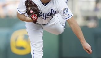 Kansas City Royals pitcher Danny Duffy throws to a St. Louis Cardinals batter in the first inning of a baseball game at Kauffman Stadium in Kansas City, Mo., Saturday, Aug. 11, 2018. (AP Photo/Colin E. Braley)