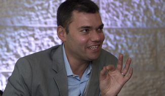 FILE - In this June 21, 2012 file photo, prominent Jewish-American commentator Peter Beinart speaks during an interview with The Associated Press in Jerusalem. Beinart, who has been critical of Israel, said that he was detained by Israeli airport authorities and interrogated about his political views on Sunday, Aug. 12, 2018, before he was allowed to enter the country. (AP Photo/Sebastian Scheiner, File)