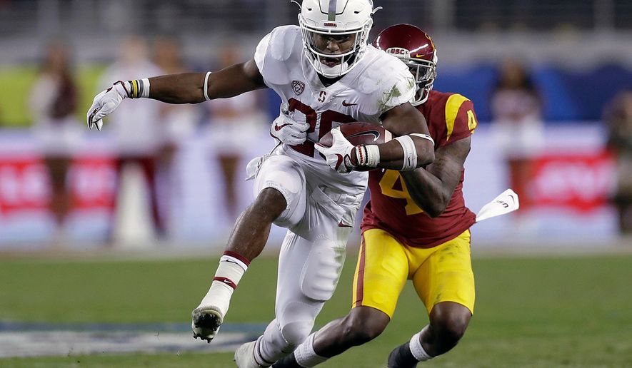FILE - In this Dec. 1, 2017, file photo, Stanford running back Bryce Love (20) runs in front of Southern California safety Chris Hawkins (4) during the first half of the Pac-12 Conference championship NCAA college football game in Santa Clara, Calif. Love returned to Stanford for his senior season after finishing as the runner-up for the Heisman Trophy last year. He leads a crop of solid tailbacks in the Pac-12. (AP Photo/Marcio Jose Sanchez, File)