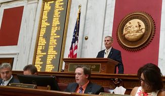 West Virginia House Speaker Pro Tempore John Overington, top, presides over the start of a hearing Monday, Aug. 13, 2018, at the state Capitol in Charleston, W. Va. The House of Delegates is considering the impeachment of the entire state Supreme Court in a scandal over $3.2 million in office renovations. (AP Photo/John Raby)