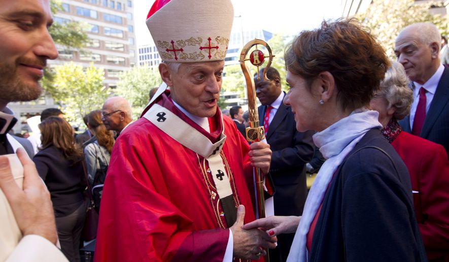 Cardinal Donald W. Wuerl, Archbishop of Washington shaking hands with churchgoers at St. Mathews Cathedral after the Red Mass in Washington on Oct. 1, 2017. In 1993, Cardinal Wuerl, then bishop of the Diocese of Pittsburgh, coined the term "circle of secrecy" to describe the methods in place to protect accused members of the church, according to the report. (Associated Press)