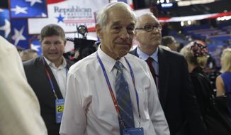In this Aug. 28, 2012, file photo, Rep. Ron Paul, R-Texas, arrives on the floor at the Republican National Convention in Tampa, Fla. (AP Photo/Charles Dharapak, File)