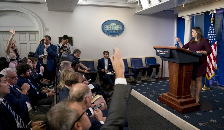 White House press secretary Sarah Huckabee Sanders calls on a reporter during the daily press briefing at the White House, Tuesday, Aug. 14, 2018, in Washington. Sanders took questions about former White House staffer Omarosa Manigault and other topics. (AP Photo/Andrew Harnik)