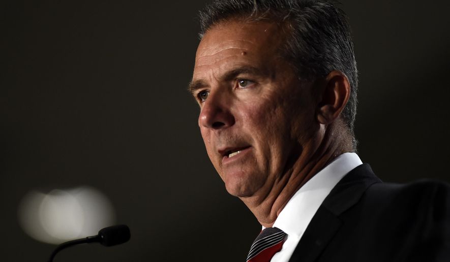 File-This July 24, 2018, file photo shows Ohio State head coach Urban Meyer speaking at the Big Ten Conference NCAA college football Media Days in Chicago. The Big Ten East has been called the toughest division in college football, and that’s expected to be the case again this season even with the uncertainty surrounding Meyer and his defending conference champion Ohio State Buckeyes. (AP Photo/Annie Rice, File)