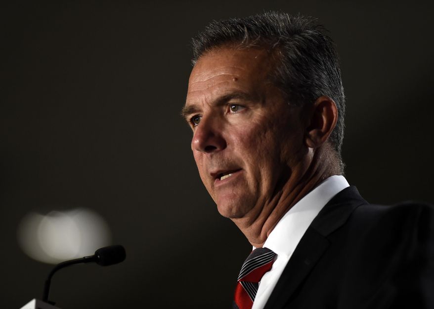 File-This July 24, 2018, file photo shows Ohio State head coach Urban Meyer speaking at the Big Ten Conference NCAA college football Media Days in Chicago. The Big Ten East has been called the toughest division in college football, and that’s expected to be the case again this season even with the uncertainty surrounding Meyer and his defending conference champion Ohio State Buckeyes. (AP Photo/Annie Rice, File)