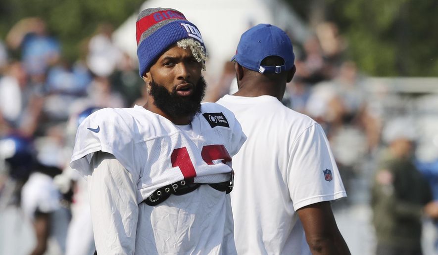 New York Giants receiver Odell Beckham Jr., walks on the field at the Detroit Lions football training facility, Tuesday, Aug. 14, 2018, in Allen Park, Mich. (AP Photo/Carlos Osorio)