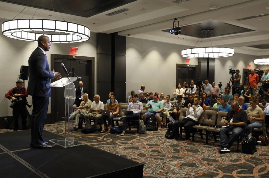 Maryland athletic director Damon Evans, left, speaks at a news conference held to address the school's football program and the death of offensive lineman Jordan McNair, who collapsed on a practice field and subsequently died, in College Park, Md. (AP Photo/Patrick Semansky)