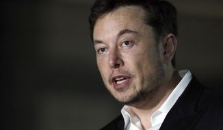 FILE - In this June 14, 2018, file photo, Tesla CEO Elon Musk speaks at a news conference in Chicago.  Tesla is forming a special committee to evaluate  Musk’s plan to take the company private. The electric car maker said Tuesday, Aug. 14, 2018  that the committee will include three independent directors. The committee has yet to receive a formal proposal from Musk on a going private transaction. (AP Photo/Kiichiro Sato, File)