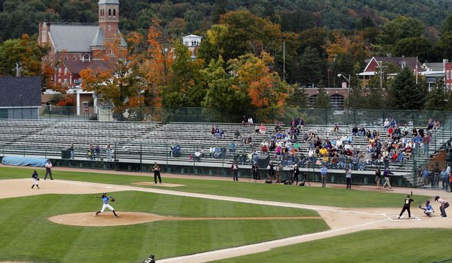 FILE - In this Sept. 25, 2014, file photo, an exhibition baseball game is played at Doubleday Field in downtown Cooperstown, N.Y., near the National Baseball Hall of Fame. There&#x27;s much more to the one-stoplight village than its No. 1 attraction, but the National Baseball Hall of Fame on Main Street is truly a great shrine for the game, and even if you don&#x27;t have a player to root for you can check out a game at Doubleday Field or at any of the 20-plus fields a few miles away at Cooperstown Dreams Park. (AP Photo/Mike Groll, File)