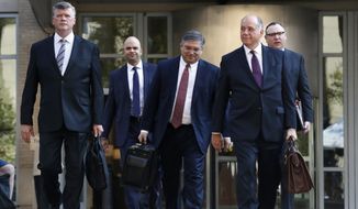 Members of the defense team for Paul Manafort, from left, Kevin Downing, Jay Nanavati, Richard Westling, Thomas Zehnle, and Brian Ketcham, walk to federal court for closing arguments in the trial of the former Trump campaign chairman, in Alexandria, Va., Wednesday, Aug. 15, 2018. (AP Photo/Jacquelyn Martin)