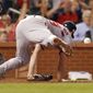 Washington Nationals starting pitcher Jeremy Hellickson is injured while covering home after throwing a wild pitch scoring St. Louis Cardinals&#39; Harrison Bader during the fifth inning of a baseball game Wednesday, Aug. 15, 2018, in St. Louis. Hellickson left the game. (AP Photo/Jeff Roberson)