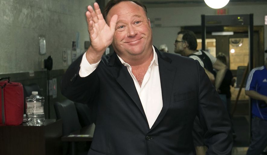 In this April 19, 2017, file photo, Alex Jones, a right-wing radio host and conspiracy theorist, arrives at the courthouse in Austin, Texas. (Jay Janner/Austin American-Statesman via AP, File)