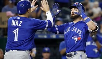 Toronto Blue Jays&#39; Kevin Pillar celebrates with Aledmys Diaz (1) after hitting a two-run home run during the eighth inning of a baseball game against the Kansas City Royals Tuesday, Aug. 14, 2018, in Kansas City, Mo. (AP Photo/Charlie Riedel)