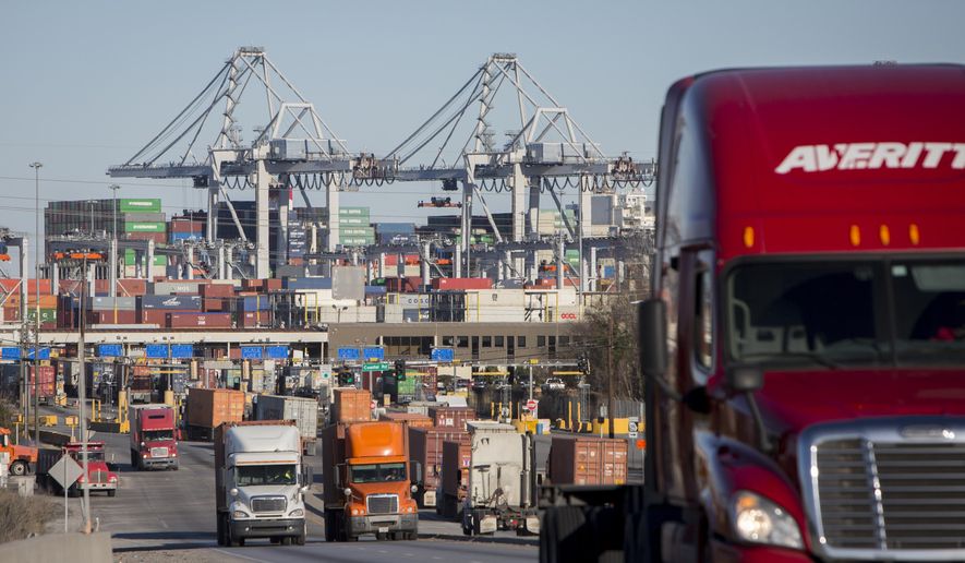 FILE- In this Jan. 30, 2018, file photo, tractor-trailers move cargo out of the Port of Savannah in Savannah, Ga. U.S. productivity grew at an annual rate of 2.9 percent in the second quarter, the fastest pace in more than three years, while labor costs actually fell. On Wednesday, Aug. 15, The Labor Department says the April-June increase in productivity followed a much weaker 0.3 percent rate of gain in the first quarter. (AP Photo/Stephen B. Morton, File)