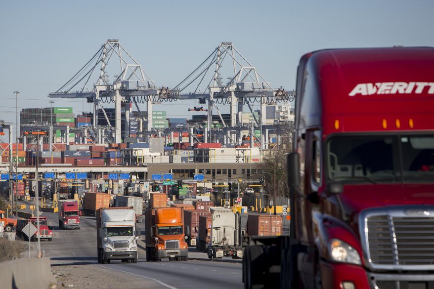 FILE- In this Jan. 30, 2018, file photo, tractor-trailers move cargo out of the Port of Savannah in Savannah, Ga. U.S. productivity grew at an annual rate of 2.9 percent in the second quarter, the fastest pace in more than three years, while labor costs actually fell. On Wednesday, Aug. 15, The Labor Department says the April-June increase in productivity followed a much weaker 0.3 percent rate of gain in the first quarter. (AP Photo/Stephen B. Morton, File)