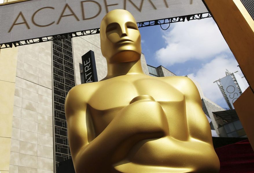 FILE - In this Feb. 21, 2015 file photo, an Oscar statue appears outside the Dolby Theatre for the 87th Academy Awards in Los Angeles. The diversity crisis in Hollywood may rage on, but the Academy of Motion Picture Arts and Sciences is trying to open up access to the entertainment business for people from underrepresented communities. Academy Gold, an inclusive film academy internship program that just wrapped its second summer, helps students learn the ropes of the entertainment business and get a foot in the door before college graduation. (Photo by Matt Sayles/Invision/AP, File)