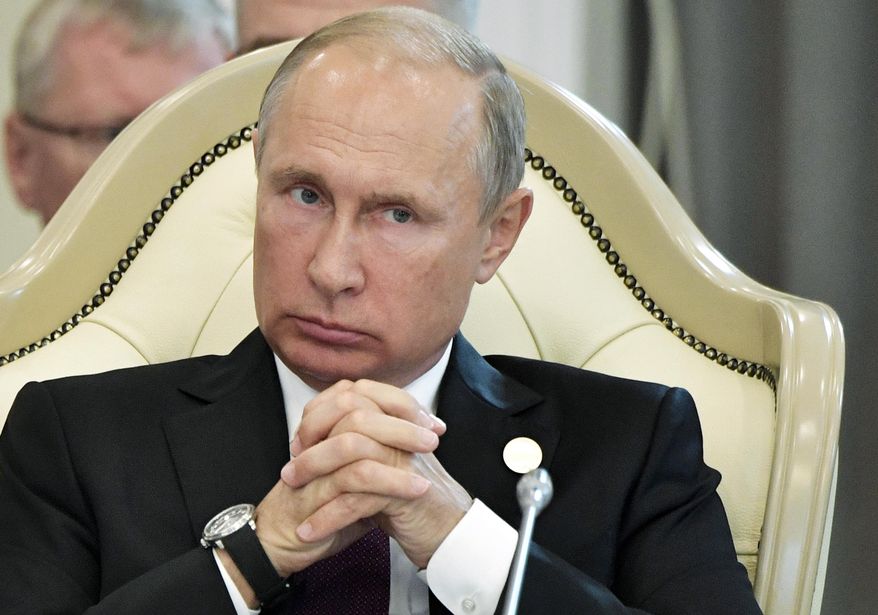 Russian President Vladimir Putin, attends a meeting during the 5th Caspian summit in Aktau, the Caspian Sea port in Kazakhstan, Sunday, Aug. 12, 2018. (Alexei Nikolsky, Sputnik, Kremlin Pool Photo via AP)