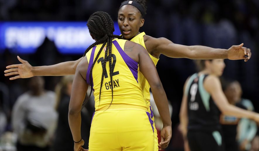 Los Angeles Sparks' Nneka Ogwumike, center right, celebrates after scoring with teammate Chelsea Gray (12) during the second half of a WNBA basketball game against the New York Liberty, Tuesday, Aug. 14, 2018, in Los Angeles. (AP Photo/Marcio Jose Sanchez)