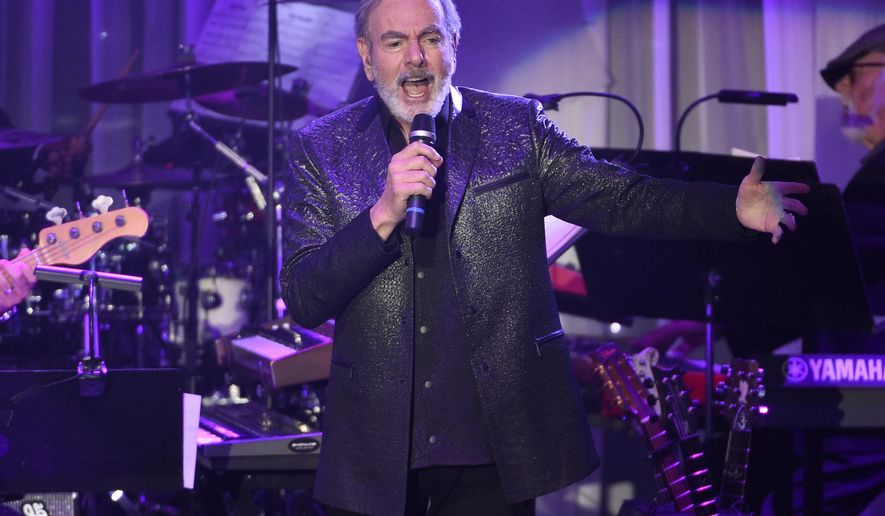 FILE - In this Feb. 11, 2017 file photo, Neil Diamond performs at the Clive Davis and The Recording Academy Pre-Grammy Gala in Beverly Hills, Calif. Diamond&#39;s latest &amp;quot;Hot August Night III,&amp;quot; releases on Friday, Aug. 17. (Photo by Chris Pizzello/Invision/AP, File)