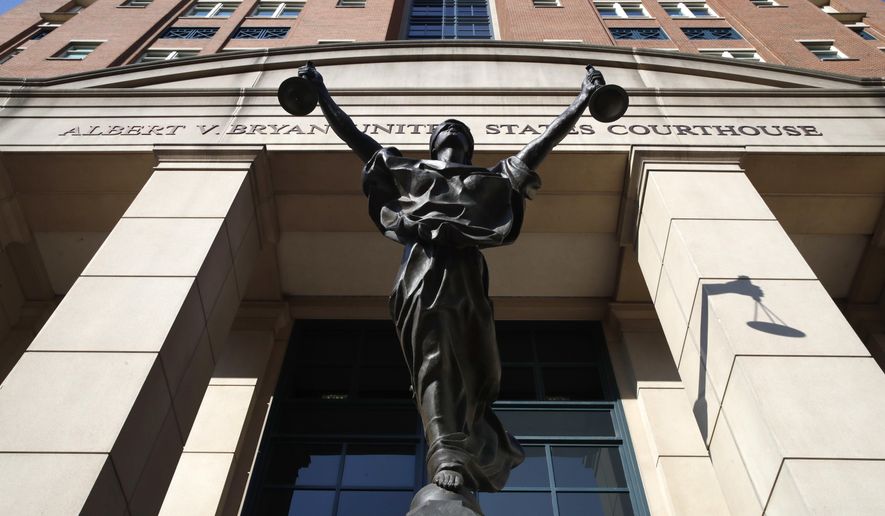 A statue of Justice is seen at federal court in this file photo from Alexandria, Va., Wednesday, Aug. 15, 2018. (AP Photo/Jacquelyn Martin) **FILE**