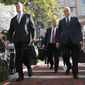 Members of the defense team for Paul Manafort, from left, Kevin Downing, Richard Westling, and Thomas Zehnle, walk to federal court for closing arguments in the trial of the former Trump campaign chairman, in Alexandria, Va., Wednesday, Aug. 15, 2018. (AP Photo/Jacquelyn Martin)