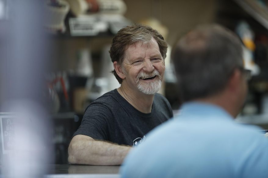 Baker Jack Phillips, owner of Masterpiece Cakeshop, manages his shop after a U.S. Supreme Court issued a limited ruling in his favor after he refused to make a wedding cake for a same-sex couple, June 4, 2018. He is suing Colorado after officials ruled against him in another alleged discrimination case in which his shop refused to make a cake celebrating a gender transition. (AP Photo/David Zalubowski) ** FILE **