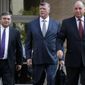 Members of the defense team for Paul Manafort, including Richard Westling, left, Kevin Downing, Thomas Zehnle, walk to federal court as jury deliberations begin in the trial of the former Trump campaign chairman, in Alexandria, Va., Thursday, Aug. 16, 2018. (AP Photo/Jacquelyn Martin)