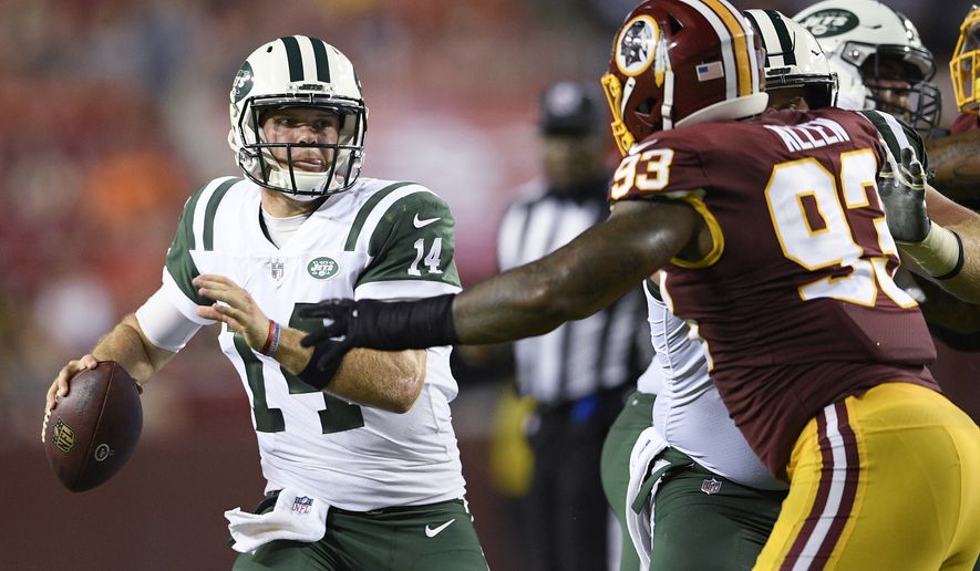 New York Jets quarterback Sam Darnold (14) looks to pass as Washington Redskins defensive end Jonathan Allen (93) is blocked during the first half of a preseason NFL football game Thursday, Aug. 16, 2018, in Landover, Md. (AP Photo/Nick Wass)