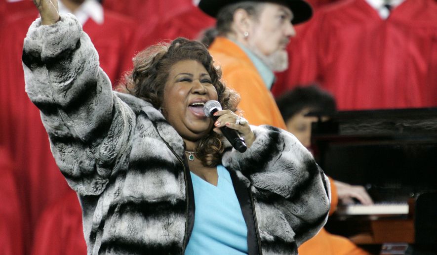 In this Feb. 5, 2006, file photo, Aretha Franklin and Dr. John, background on piano, perform the national anthem before the Super Bowl XL football game in Detroit.  Franklin died Thursday, Aug. 16, 2018 at her home in Detroit.  She was 76.  (AP Photo/Gene J. Puskar, File)