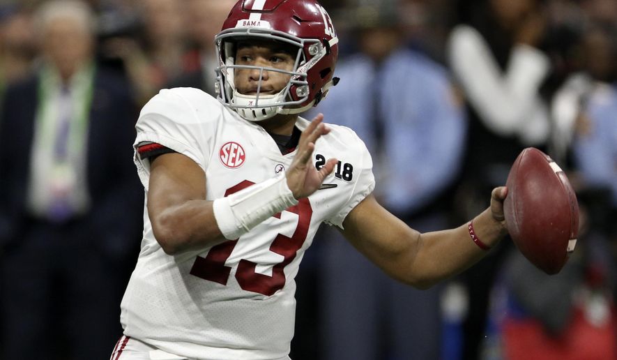 File-This Jan. 8, 2018, file photo shows Alabama quarterback Tua Tagovailoa (13) looking to pass against Georgia during the College Football Playoff national championship game in Atlanta, Ga. The quarterback battle between 28-game starter Jalen Hurts and Tagovailoa has hogged the headlines, overshadowing the fact that eight members of the nation's top defense were drafted. Gone are the starting secondary, including All-American Minkah Fitzpatrick, and a top reserve. (C.B. Schmelter/Chattanooga Times Free Press via AP, File)