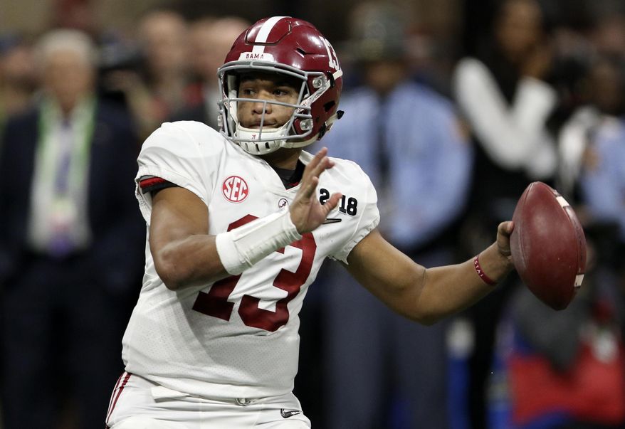 File-This Jan. 8, 2018, file photo shows Alabama quarterback Tua Tagovailoa (13) looking to pass against Georgia during the College Football Playoff national championship game in Atlanta, Ga. The quarterback battle between 28-game starter Jalen Hurts and Tagovailoa has hogged the headlines, overshadowing the fact that eight members of the nation's top defense were drafted. Gone are the starting secondary, including All-American Minkah Fitzpatrick, and a top reserve. (C.B. Schmelter/Chattanooga Times Free Press via AP, File)
