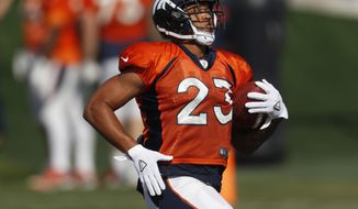 Denver Broncos running back Devontae Booker takes part in drills during a joint NFL football training camp session against the Chicago Bears Wednesday, Aug. 15, 2018, at Broncos&#39; headquarters in Englewood, Colo. (AP Photo/David Zalubowski)