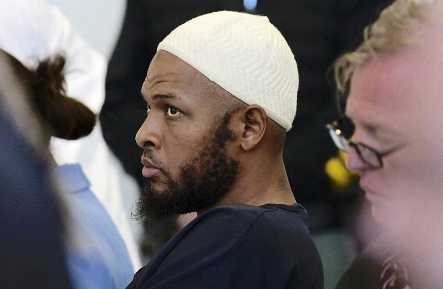 FILE - In this Monday, Aug. 13, 2018, file photo defendant Siraj Ibn Wahhaj sits in court in Taos, N.M., during a detention hearing. New Mexico forensic investigators announced Thursday, Aug. 16, that a highly decomposed body found at a desert compound in New Mexico has been identified as a missing Georgia boy with severe disabilities. The New Mexico Office of the Medical Investigator said Thursday that the remains were those of Abdul-ghani Wahhaj. (Roberto E. Rosales/The Albuquerque Journal via AP, Pool, File)