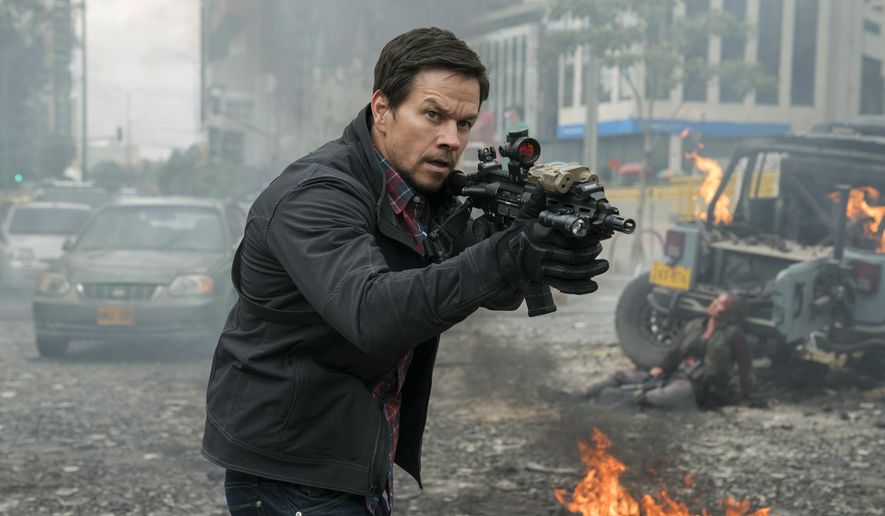 This cover image released by STXfilms shows Mark Wahlberg in a scene from "Mile 22." (STXfilms via AP)
