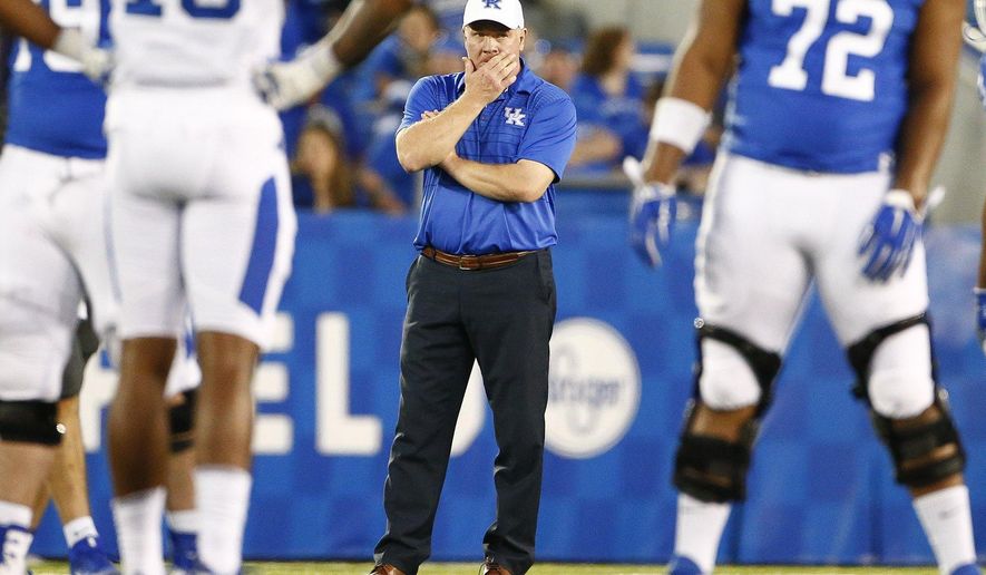 Kentucky head coach Mark Stoop watches his team during the NCAA college football Blue-White Spring Game Friday April 13, 2018 at Kroger Field in Lexington, Ky., Friday, April 13, 2018. (Silas Walker/Lexington Herald-Leader via AP)