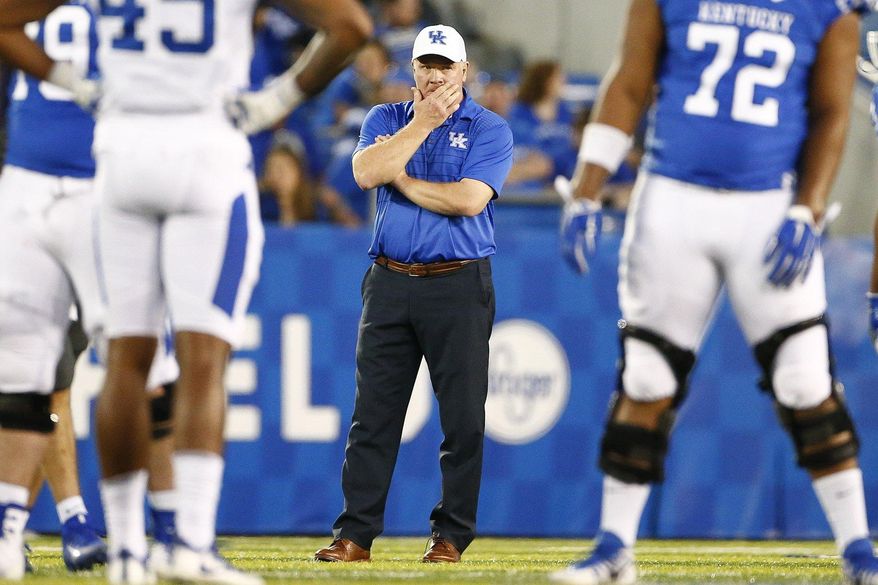 Kentucky head coach Mark Stoop watches his team during the NCAA college football Blue-White Spring Game Friday April 13, 2018 at Kroger Field in Lexington, Ky., Friday, April 13, 2018. (Silas Walker/Lexington Herald-Leader via AP)