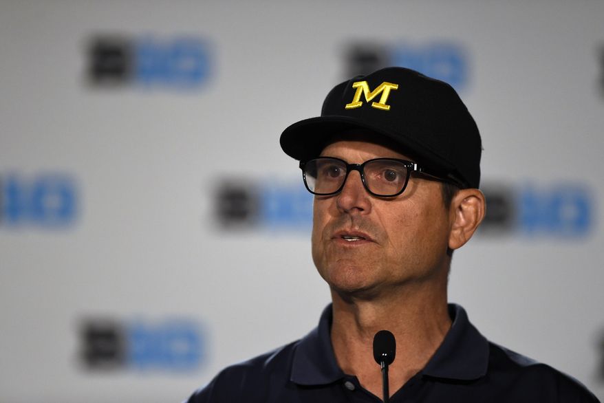 File-This July 23, 2018, file photo shows Michigan head coach Jim Harbaugh speaking at the Big Ten Conference NCAA college football Media Days in Chicago. Harbaugh is in his fourth year, giving him time to assemble perhaps his best team. The Wolverines, though, may be hard pressed to match the 10-win seasons Harbaugh had in his first two years. (AP Photo/Annie Rice, File)