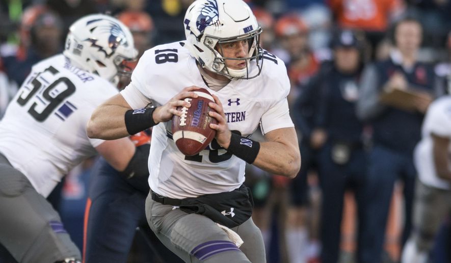 FILE - In this Nov. 25, 2017, file photo, Northwestern quarterback Clayton Thorson (18) looks for a receiver during the first half of the team's NCAA college football game against Illinois in Champaign, Ill. Thorson hopes to play in the opener at Purdue after last season ended with him getting carted off the field with a torn anterior cruciate ligament in his right knee. (AP Photo/Bradley Leeb, File)