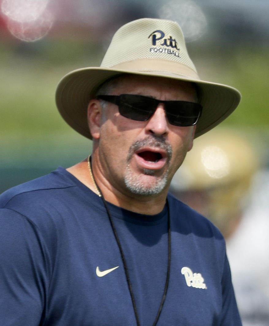 In this photo from Aug. 10, 2018, Pittsburgh head coach Pat Narduzzi watches drills during an NCAA college football practice, in Pittsburgh. Sophomore quarterback Kenny Pickett carries the hype, but Pittsburgh's progress in head coach Pat Narduzzi's fourth season will rely heavily on the defense. (AP Photo/Keith Srakocic)